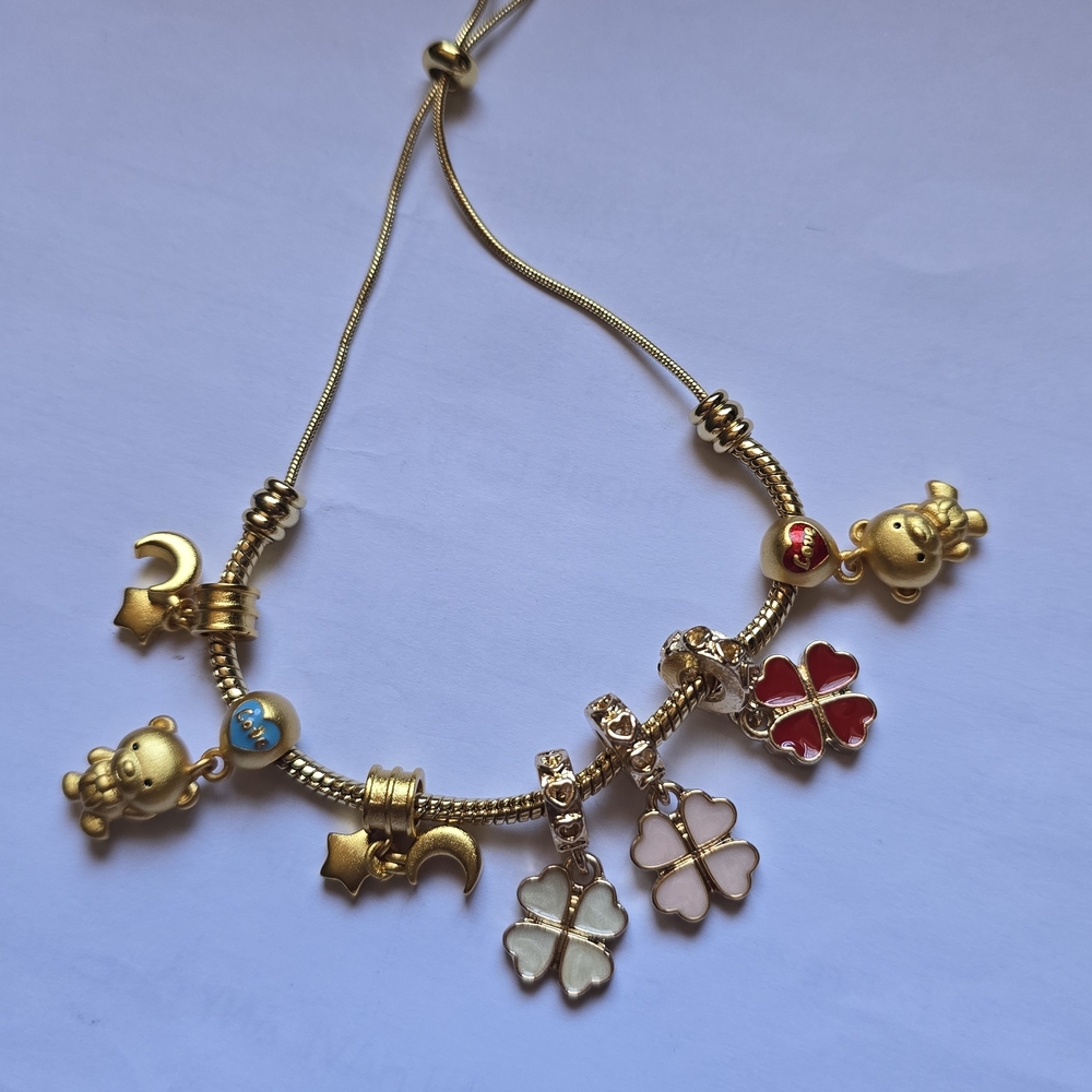 Charming Gold Bracelet with Red and White Accents